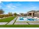 Large rectangular pool, surrounded by artificial turf and stone at 10004 Terrastone Dr, Las Vegas, NV 89148