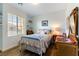 Charming bedroom with a white metal bed frame and built-in shelves at 10588 El Cerrito Chico St, Las Vegas, NV 89179