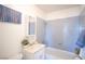 Clean bathroom with light gray tile and vanity at 107 Manganese St, Henderson, NV 89015