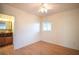 Bedroom with wood floors, ceiling fan, closet, and adjacent bathroom at 107 Manganese St, Henderson, NV 89015