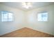 Well-lit bedroom featuring wood floors and two windows at 107 Manganese St, Henderson, NV 89015
