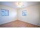 Bright bedroom with wood floors, ceiling fan, and multiple windows at 107 Manganese St, Henderson, NV 89015