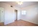Bedroom with wood floors, ceiling fan, closet, and access to bathroom at 107 Manganese St, Henderson, NV 89015