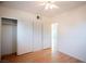 Bedroom featuring wood floors, ceiling fan and closet at 107 Manganese St, Henderson, NV 89015