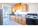 Updated kitchen with wood cabinets and granite countertops at 107 Manganese St, Henderson, NV 89015