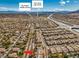 Expansive aerial view of a residential community near Sig Rogich Middle School and Palo Verde High School with mountain views at 1104 Bower Basin St, Las Vegas, NV 89144