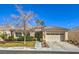 Charming single-story home with a tile roof, mature landscaping, and an attached two-car garage at 1104 Bower Basin St, Las Vegas, NV 89144