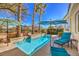 Inviting pool area featuring a small pool, palm trees, an umbrella, and a lounge chair at 1104 Bower Basin St, Las Vegas, NV 89144