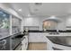 Modern kitchen with dark granite counters and white cabinets, offering ample counter space at 11158 Antonine Wall Ct, Las Vegas, NV 89141