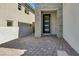 Modern front entrance with paver walkway and stone accents at 11851 River Hawk Ave, Las Vegas, NV 89138