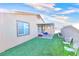 Backyard with covered patio, grass, and seating at 1290 El Solindo Ln, Henderson, NV 89002