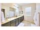 Double vanity bathroom with granite counters at 1290 El Solindo Ln, Henderson, NV 89002