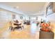 Bright dining room with wood table and chairs, open to living area at 1290 El Solindo Ln, Henderson, NV 89002