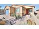 One story house with blue garage door and red front door at 1290 El Solindo Ln, Henderson, NV 89002