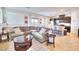 Open concept living room with sectional sofa and kitchen at 1290 El Solindo Ln, Henderson, NV 89002