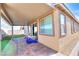 Covered patio with tile flooring, adjacent to backyard at 1290 El Solindo Ln, Henderson, NV 89002