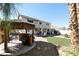 Wonderful backyard oasis with putting green, tiki bar, and patio at 1306 Big Tree Ave, North Las Vegas, NV 89031