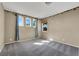 Well-lit bedroom featuring gray carpet and palm-tree border at 1306 Big Tree Ave, North Las Vegas, NV 89031