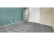 Bright bedroom with teal accent wall and ample closet space at 1306 Big Tree Ave, North Las Vegas, NV 89031