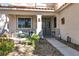 Inviting front porch with seating area, stone pathway, and landscaping at 1306 Big Tree Ave, North Las Vegas, NV 89031