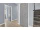 Clean hallway with gray walls and tile flooring at 1306 Big Tree Ave, North Las Vegas, NV 89031
