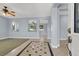 Open concept living room and entryway with tile flooring and neutral walls at 1306 Big Tree Ave, North Las Vegas, NV 89031