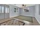 Spacious living room with tile floors, ceiling fan, and neutral color scheme at 1306 Big Tree Ave, North Las Vegas, NV 89031