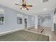 Open living room with tile floors, high ceilings, and neutral walls at 1306 Big Tree Ave, North Las Vegas, NV 89031