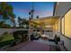 Evening view of backyard patio with fire pit and string lights at 1306 Big Tree Ave, North Las Vegas, NV 89031