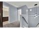 Upper hallway with carpet flooring and access to bedrooms and bathroom at 1306 Big Tree Ave, North Las Vegas, NV 89031