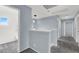 Upper hallway with carpet flooring and access to bedrooms and bathroom at 1306 Big Tree Ave, North Las Vegas, NV 89031