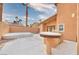Backyard patio with a built-in grill and seating area at 1411 Bareback Ct, Henderson, NV 89014