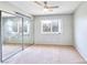 Bright bedroom with mirrored closet doors and carpet flooring at 1411 Bareback Ct, Henderson, NV 89014