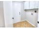 Laundry room with built-in cabinets and exterior access at 1411 Bareback Ct, Henderson, NV 89014