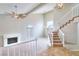 Large living room with high ceilings, fireplace and staircase at 1411 Bareback Ct, Henderson, NV 89014