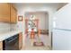 Kitchen and dining area with wood table and chairs at 1751 E Reno Ave # 206, Las Vegas, NV 89119