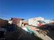 Backyard with shed, Uhaul truck, and dog at 1900 W Carey Ave, North Las Vegas, NV 89032