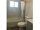 Updated bathroom with a bathtub and gray vanity at 1900 W Carey Ave, North Las Vegas, NV 89032