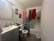 Bathroom with a shower/tub combo and gray vanity at 1900 W Carey Ave, North Las Vegas, NV 89032