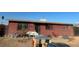 Ranch-style home with a red exterior and small yard at 1900 W Carey Ave, North Las Vegas, NV 89032
