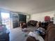 Living room with brown couches and a recliner at 1900 W Carey Ave, North Las Vegas, NV 89032