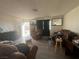Living room with brown couches and a recliner at 1900 W Carey Ave, North Las Vegas, NV 89032