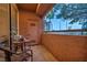 Private balcony with city views and seating for two at 220 E Flamingo Rd # 426, Las Vegas, NV 89169