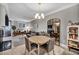 Round dining table with four chairs and chandelier at 220 E Flamingo Rd # 426, Las Vegas, NV 89169