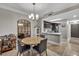 Round dining table with four chairs and chandelier at 220 E Flamingo Rd # 426, Las Vegas, NV 89169