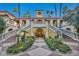 Grand entrance with double staircases and landscaping at 220 E Flamingo Rd # 426, Las Vegas, NV 89169