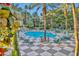 Refreshing community pool surrounded by palm trees and lounge chairs at 220 E Flamingo Rd # 426, Las Vegas, NV 89169