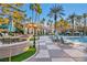 Community pool and patio with tables, chairs, and umbrellas at 220 E Flamingo Rd # 426, Las Vegas, NV 89169