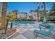 Stunning community pool area with lounge chairs and palm trees at 220 E Flamingo Rd # 426, Las Vegas, NV 89169