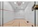 Indoor squash court with hardwood floors and glass walls at 220 E Flamingo Rd # 426, Las Vegas, NV 89169